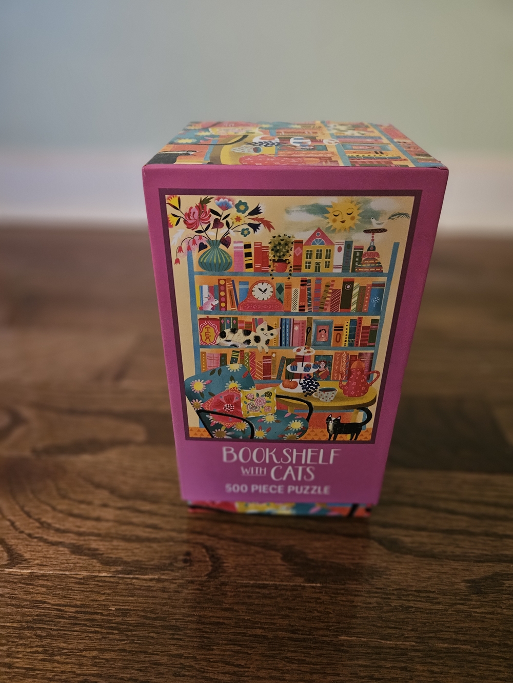 Bookshelf with Cats 500-Piece Puzzle - Bright Pink Box